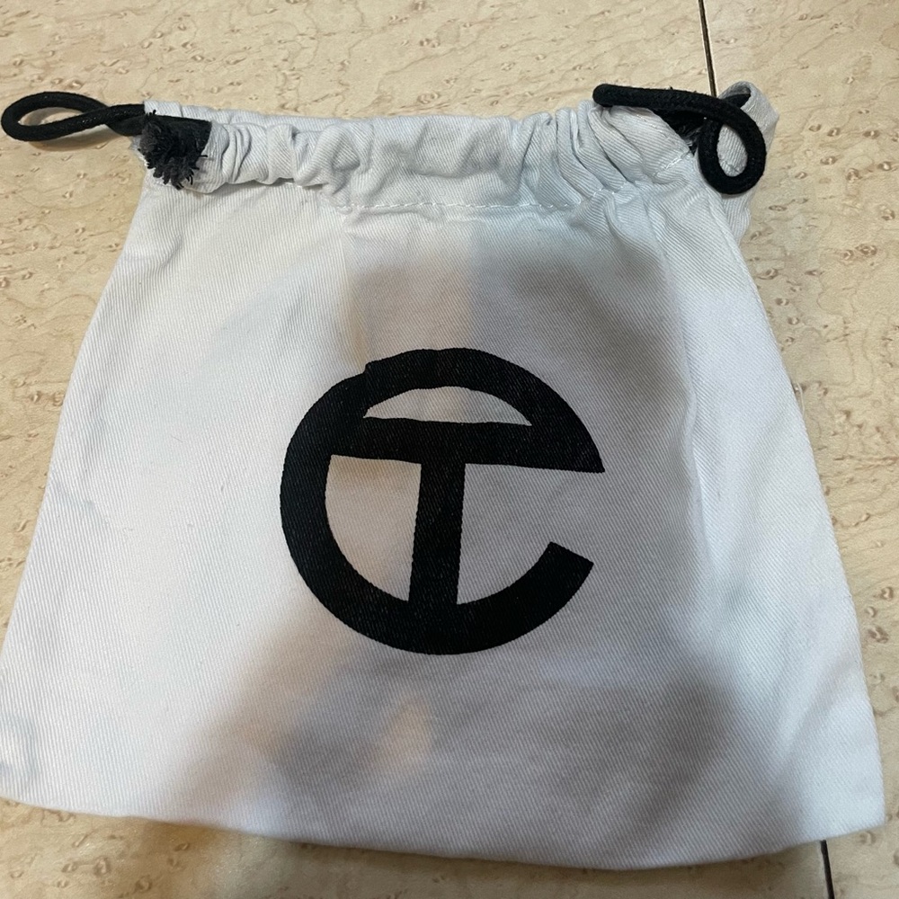 Telfar dust bag for a belt.